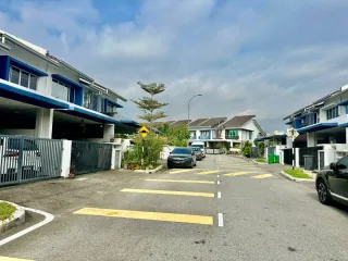 Terrace houses with blue trim and yellow road markings at Nilai Impian, Seremban