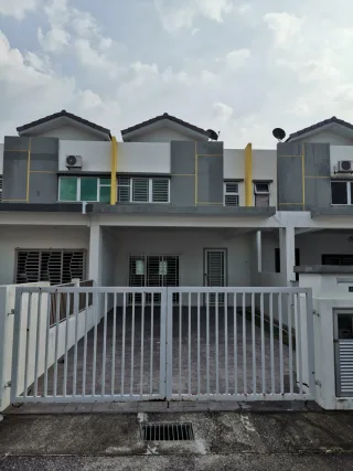 Two-storey terrace house with grey facade and yellow accents at Bandar Hillpark