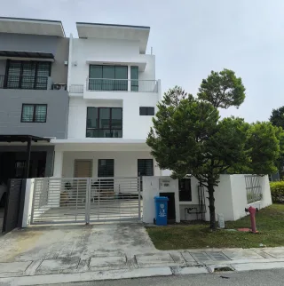 Terrace house with white facade and grey gate at Bandar Setia Alam