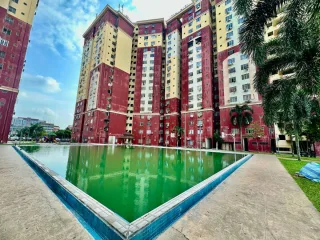 Mentari Court PJS 8 towers with green swimming pool and palm trees