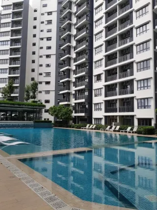 Swimming pool and tower blocks at Suria Residences, Bukit Jelutong