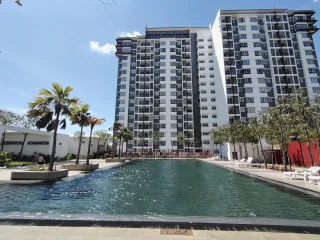 Swimming pool and tower blocks at Pangsapuri Kalista 2, Seremban