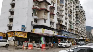 Blocks of flats and street-level shophouses at Bandar Baru Ayer Itam, Penang