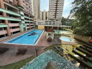 Swimming pool and surrounding apartment blocks at Sri Intan Apartment