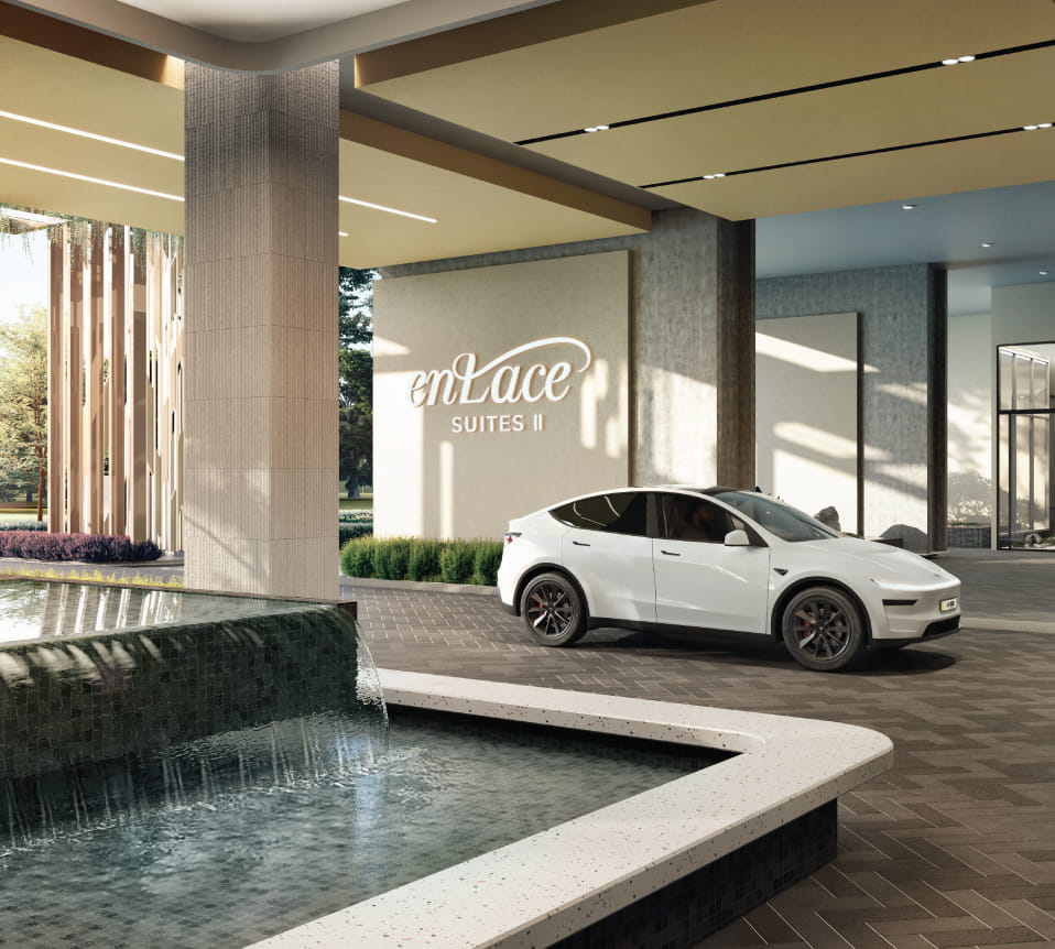The Enlace Suites II arrival court and signature wall