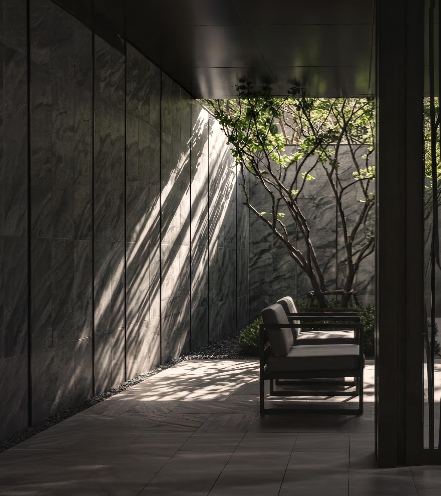 Stone, shadow and a single tree at the arrival